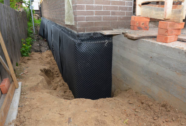 SJ Waterproofing Pros technician performing targeted Exterior Waterproofing assessment in Elkins Park, PA